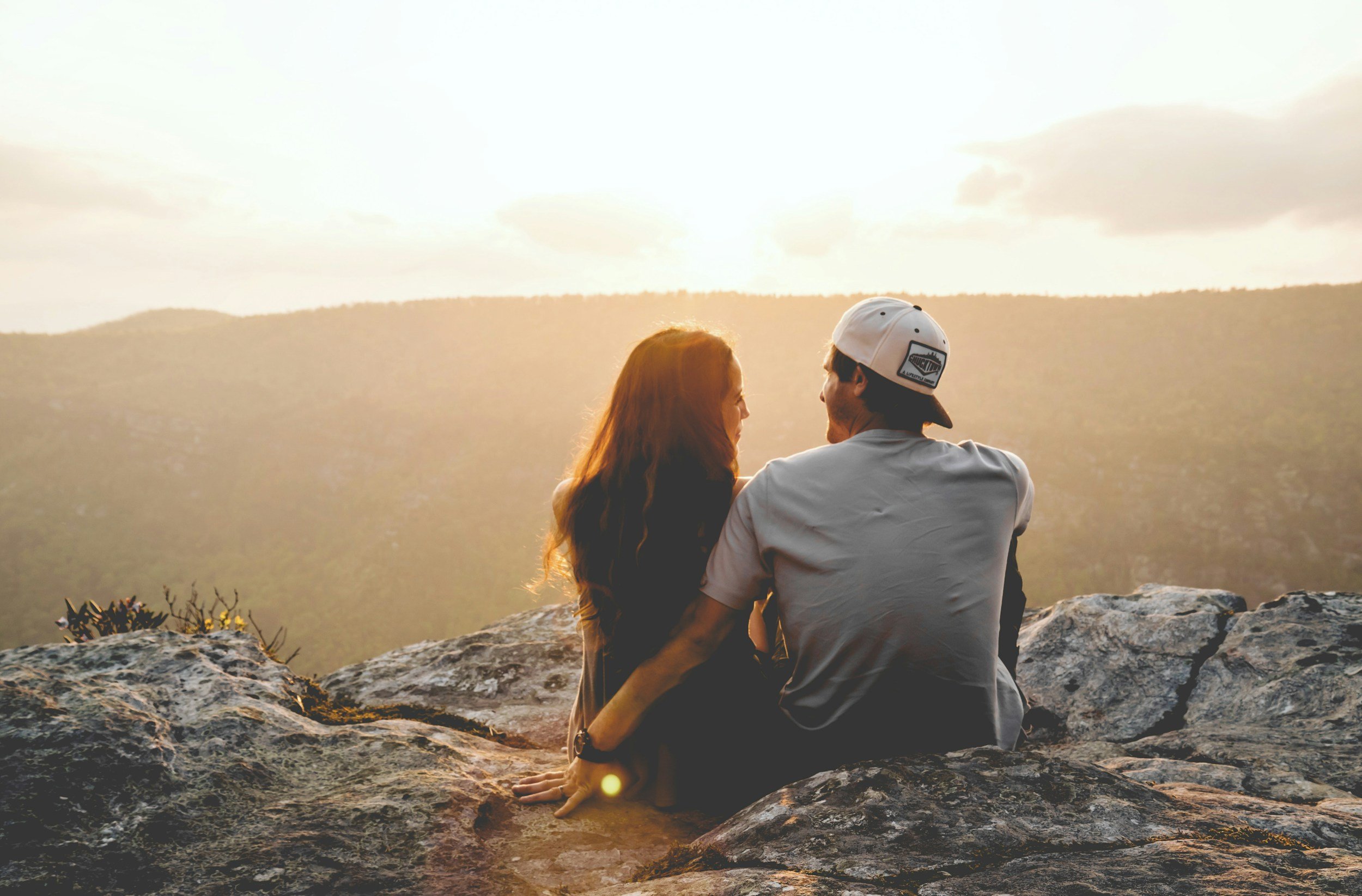 couple sitting on rocks